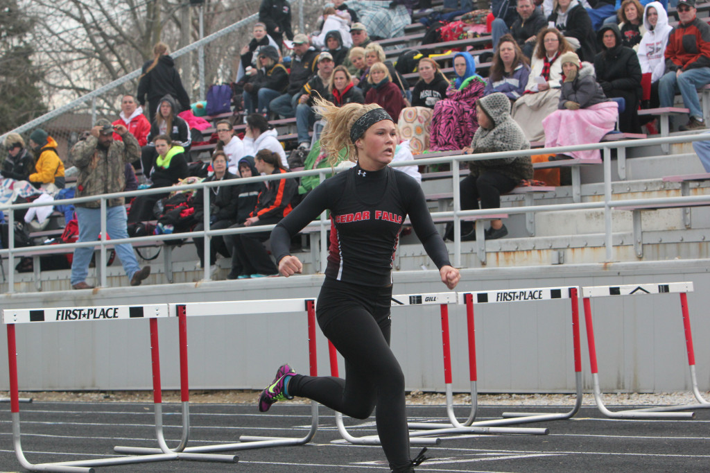 Senior Maddie Smith races through hurdles last year.